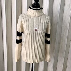 Elegant Cream Turtleneck Sweater with Black Stripes
